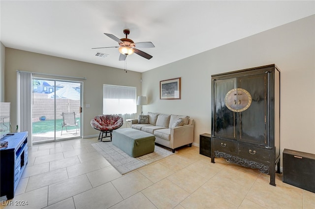 tiled living room featuring ceiling fan