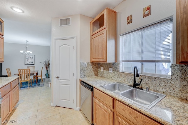 kitchen with a chandelier, dishwasher, light tile patterned flooring, sink, and decorative light fixtures