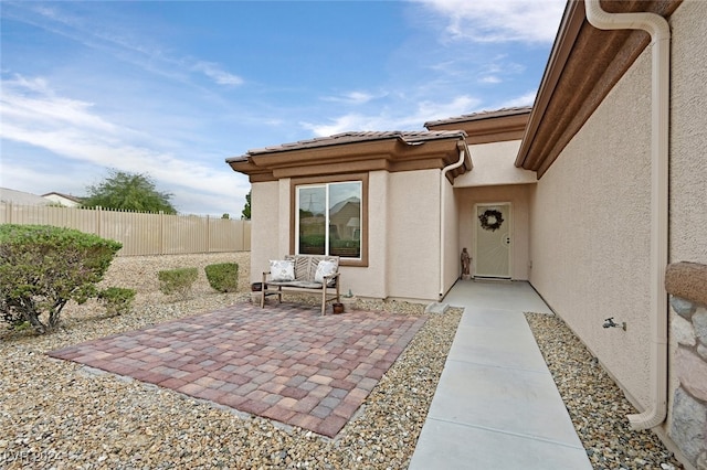 property entrance with a patio