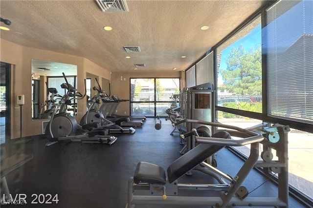 workout area with a textured ceiling