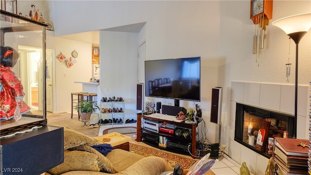 tiled living room featuring a fireplace