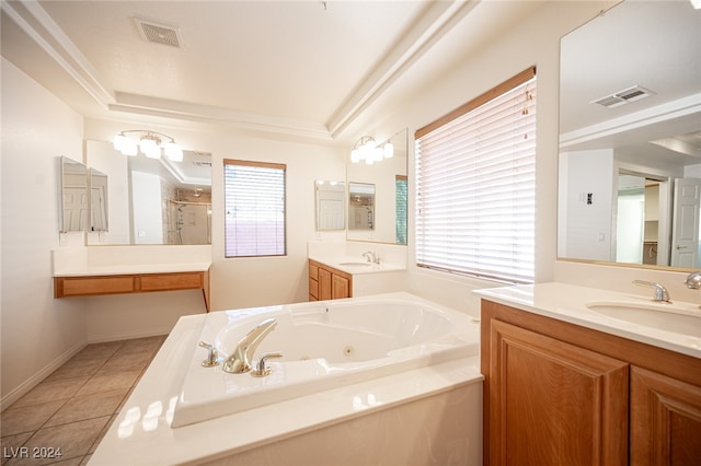 bathroom with tile patterned flooring, vanity, and separate shower and tub