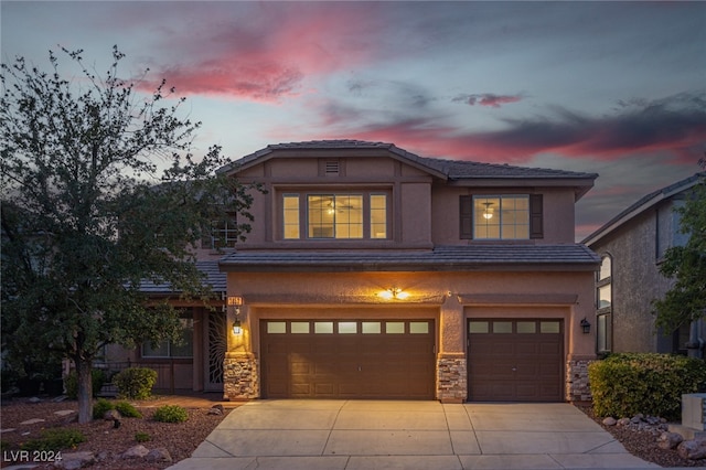 view of front of home with a garage