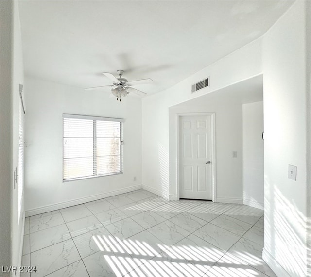 unfurnished room featuring ceiling fan