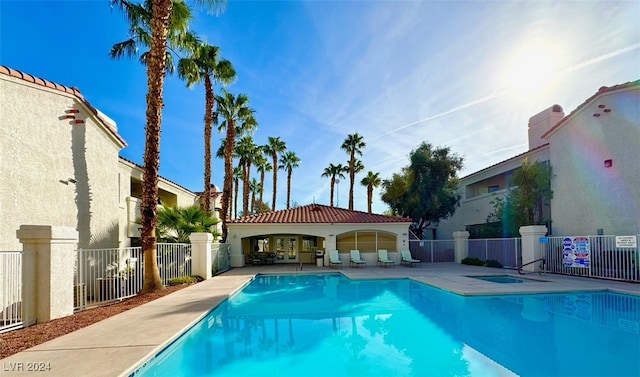 view of swimming pool featuring a patio area