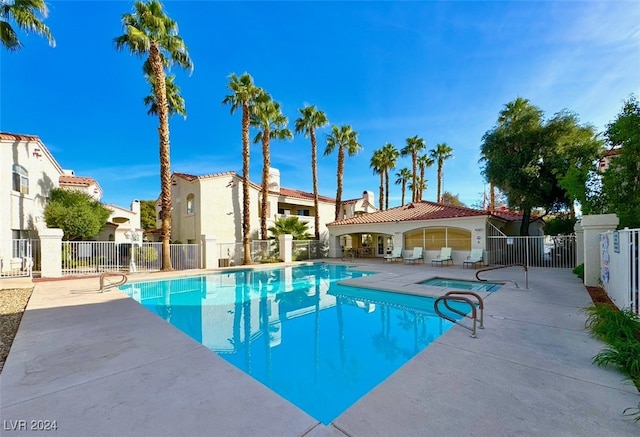 view of swimming pool featuring a patio area