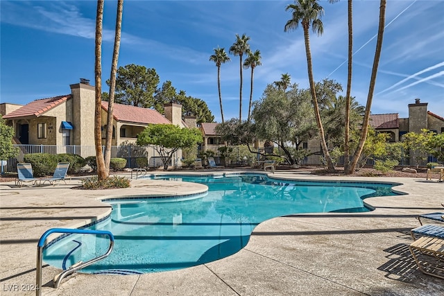 view of swimming pool with a patio area