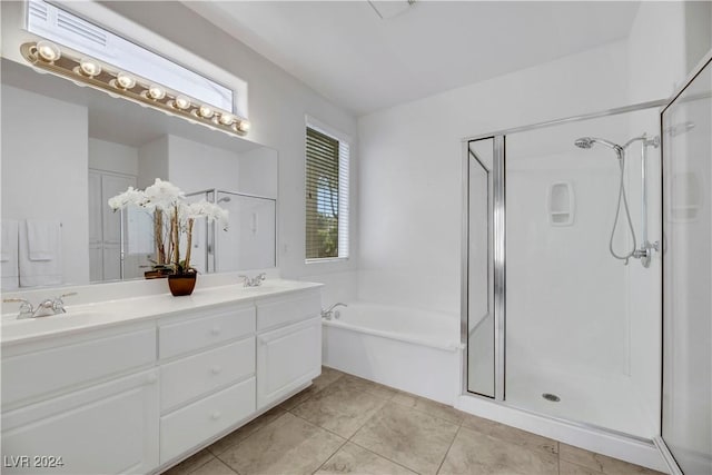 bathroom featuring tile patterned flooring, vanity, and independent shower and bath