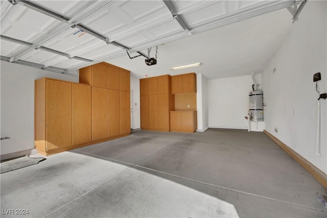 garage with strapped water heater and a garage door opener