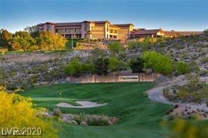 surrounding community featuring a lawn