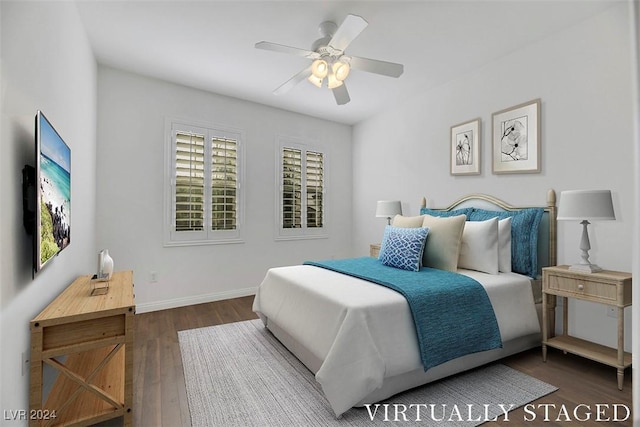 bedroom featuring ceiling fan and dark hardwood / wood-style floors