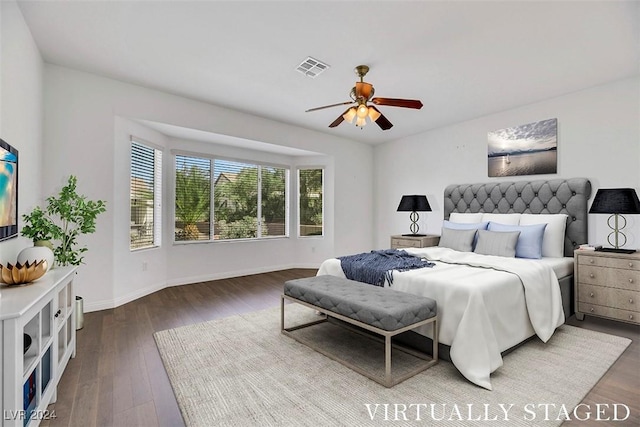 bedroom featuring ceiling fan and dark hardwood / wood-style floors