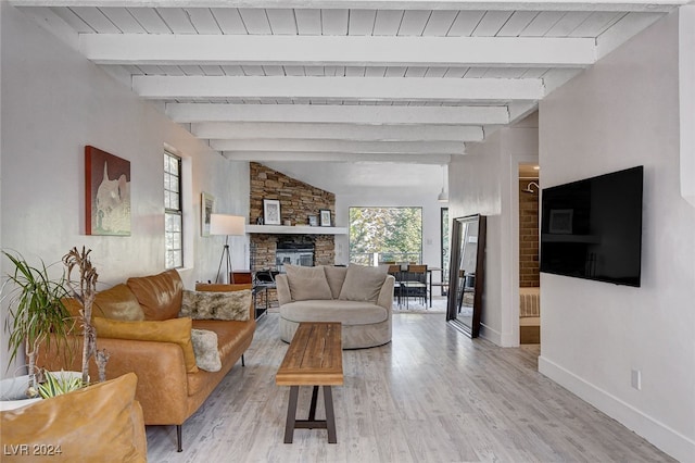 living room featuring wood ceiling, beamed ceiling, a fireplace, and hardwood / wood-style floors