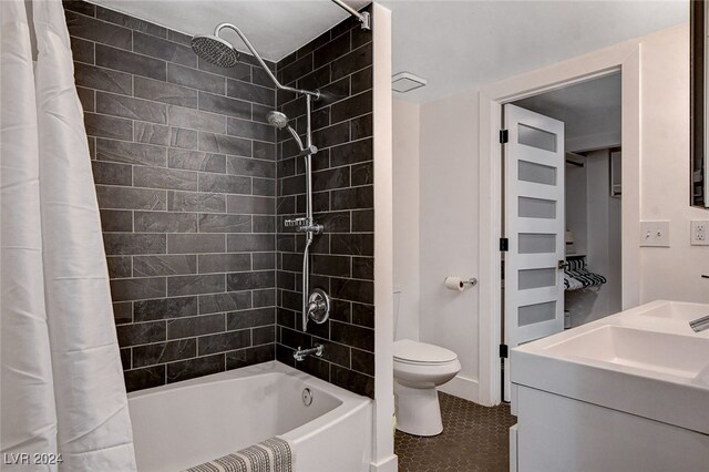 full bathroom featuring vanity, shower / tub combo with curtain, toilet, and tile patterned flooring