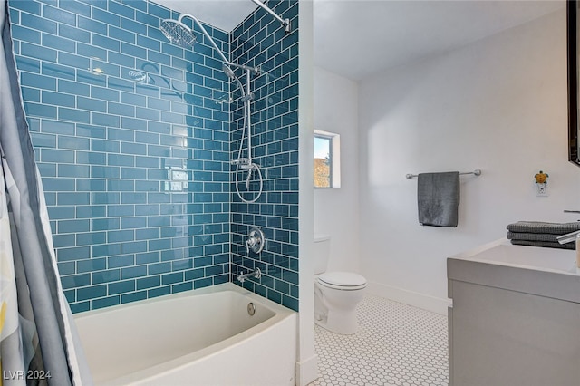 full bathroom with vanity, shower / tub combo, toilet, and tile patterned floors