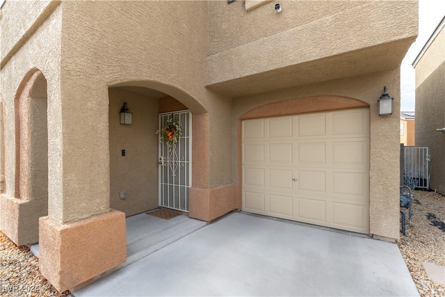 property entrance featuring a garage