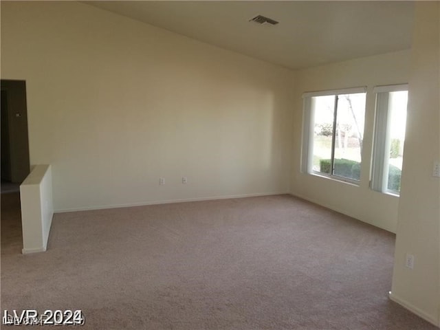 empty room with light colored carpet