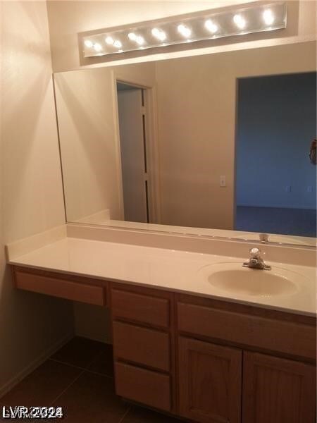 bathroom featuring vanity and tile patterned flooring