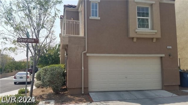 view of side of property featuring a garage