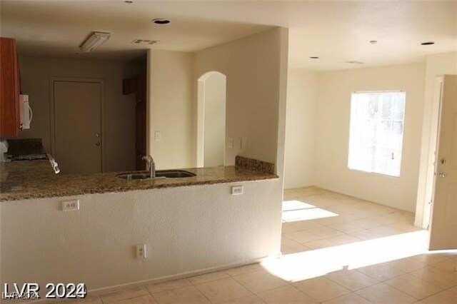 kitchen with sink and light tile patterned floors