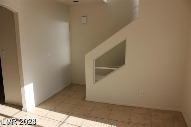 empty room with light tile patterned floors