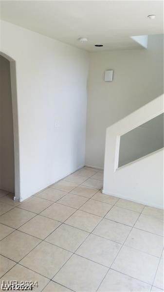 spare room with light tile patterned floors