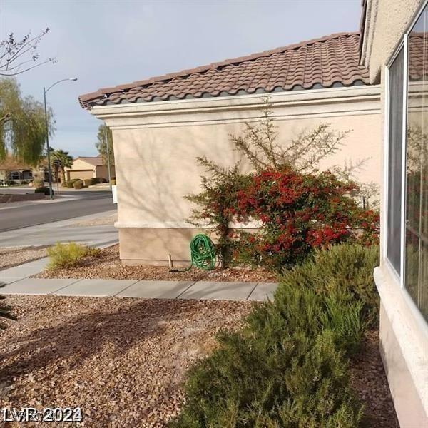 1652 Black Fox Canyon Rd, Henderson, NV 89052 - view of home's exterior with a tile roof and stucco siding