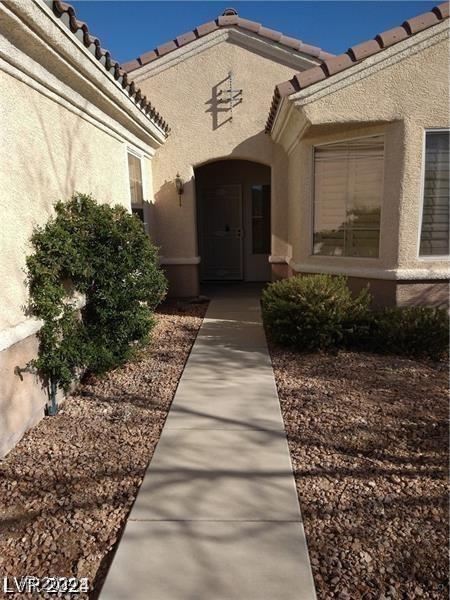 1652 Black Fox Canyon Rd, Henderson, NV 89052 - doorway to property with stucco siding