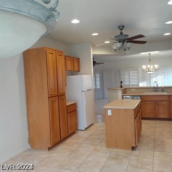 1652 Black Fox Canyon Rd, Henderson, NV 89052 - kitchen featuring freestanding refrigerator, a sink, ceiling fan, recessed lighting, and light countertops
