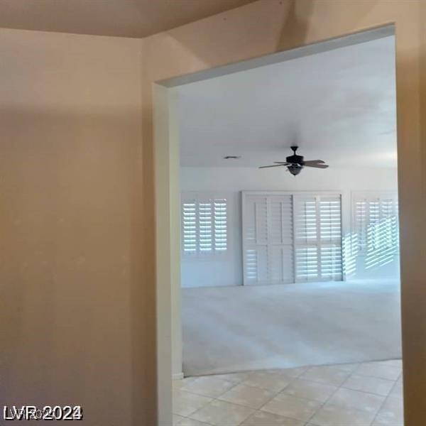 1652 Black Fox Canyon Rd, Henderson, NV 89052 - hallway featuring light carpet and healthy amount of natural light
