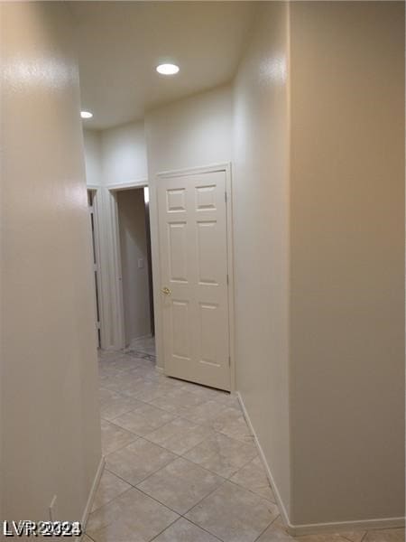 corridor with light tile patterned floors