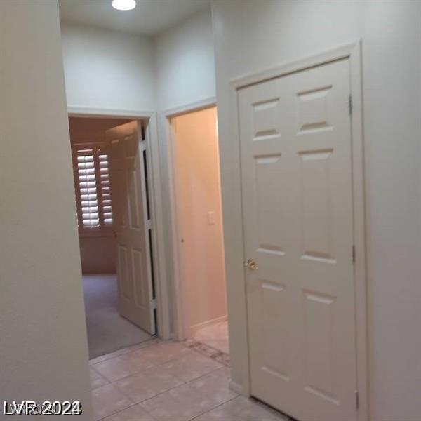 1652 Black Fox Canyon Rd, Henderson, NV 89052 - hallway with light tile patterned flooring