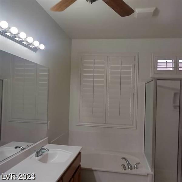 1652 Black Fox Canyon Rd, Henderson, NV 89052 - full bathroom featuring a ceiling fan, vanity, and a garden tub