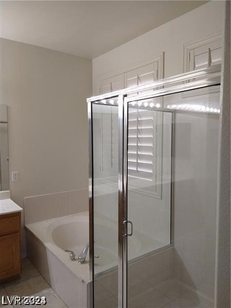 bathroom with vanity, separate shower and tub, and tile patterned floors