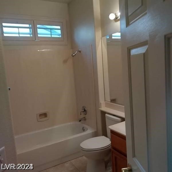 full bathroom featuring vanity, shower / tub combination, toilet, and tile patterned floors