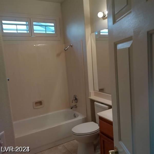 1652 Black Fox Canyon Rd, Henderson, NV 89052 - full bathroom with toilet, vanity, tile patterned floors, and shower / tub combination