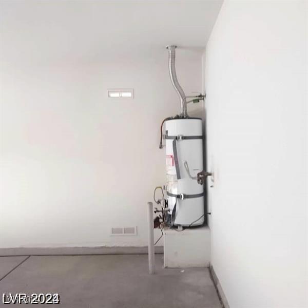 1652 Black Fox Canyon Rd, Henderson, NV 89052 - laundry room with water heater and baseboards