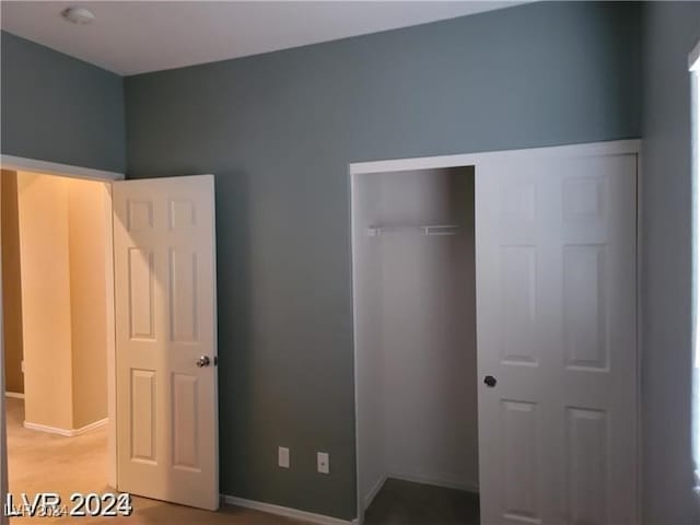 unfurnished bedroom with a closet