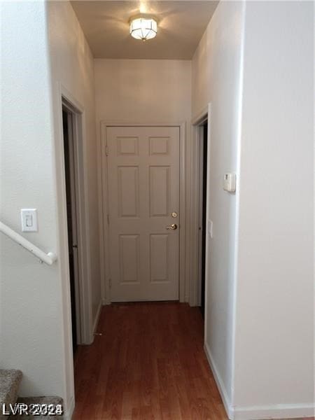 hallway featuring dark hardwood / wood-style floors