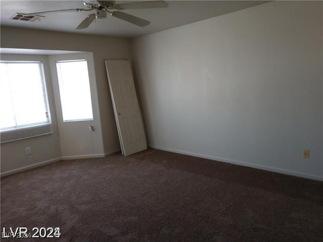 carpeted empty room with ceiling fan