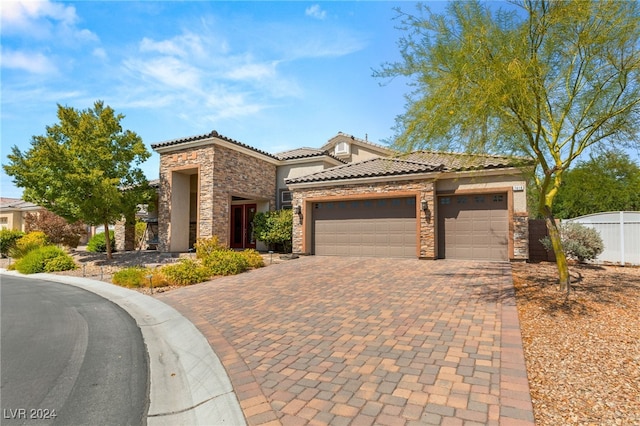 mediterranean / spanish-style house featuring a garage