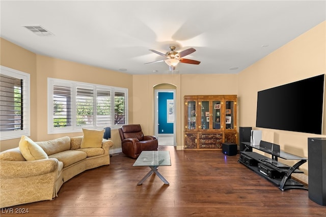 living room with ceiling fan and dark hardwood / wood-style floors