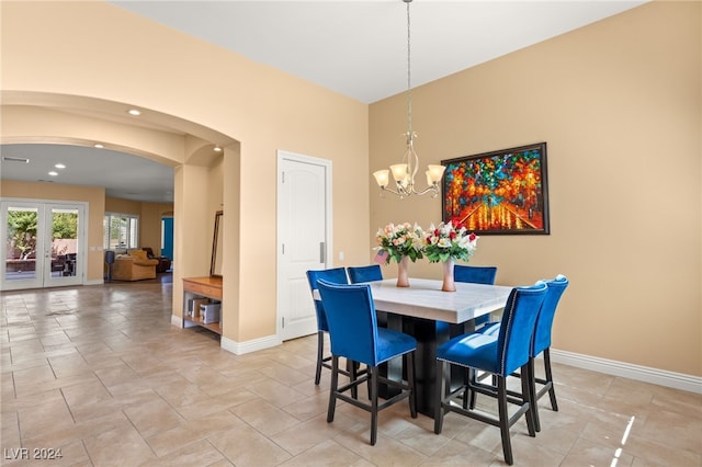 dining area featuring a notable chandelier