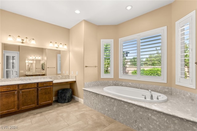 bathroom featuring vanity and a relaxing tiled tub