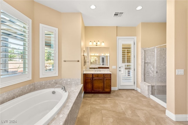 bathroom with vanity and plus walk in shower