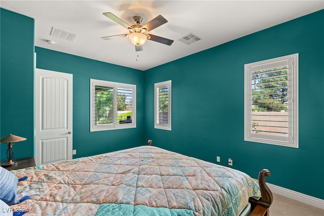 carpeted bedroom with ceiling fan