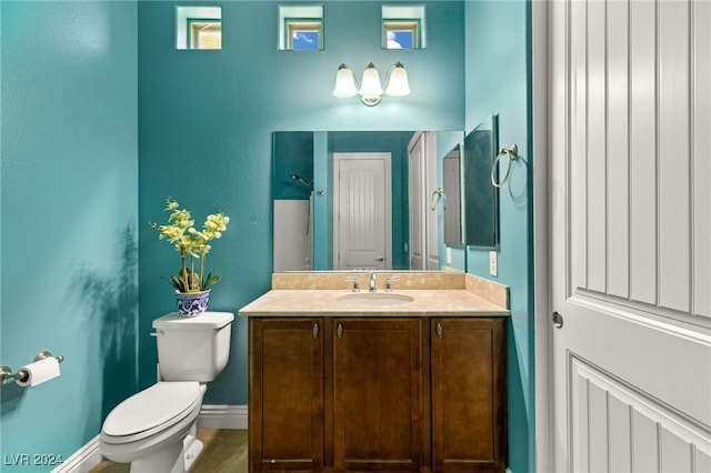 bathroom with toilet and vanity