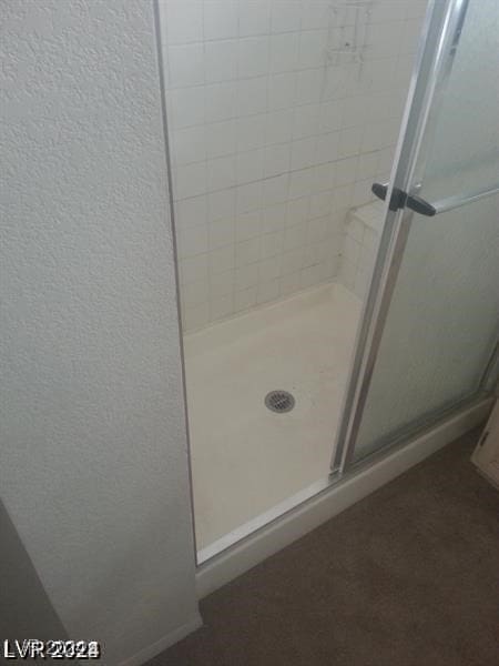 bathroom featuring an enclosed shower