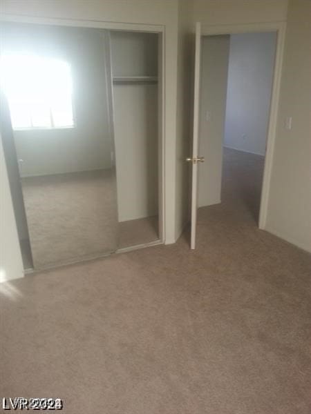 unfurnished bedroom with light carpet