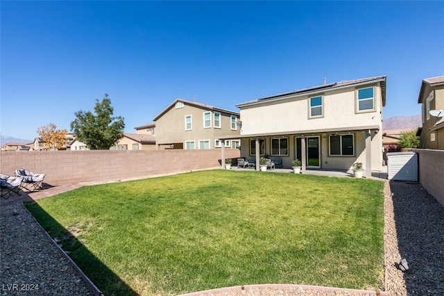4323 Creekside Cavern Ave, North Las Vegas, NV 89084 - back of property featuring a patio area and stucco siding